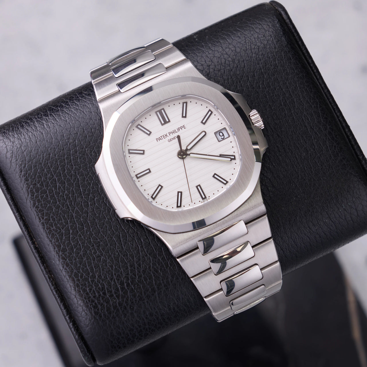 Patek Philippe Nautilus 40mm Stainless Steel White Dial (Ref 5711/1A-011) - front view on a black leather display stand