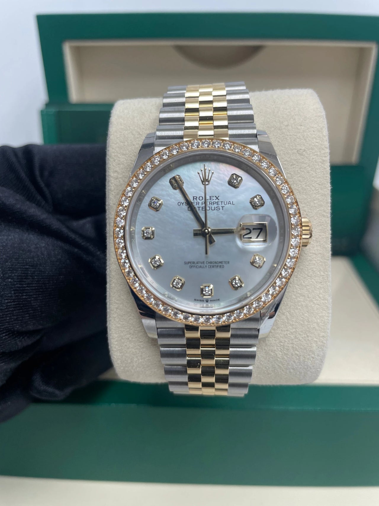 Rolex Datejust 36mm Steel and Yellow Gold White Mother of Pearl Diamond Dial Diamond Bezel Jubilee Bracelet Ref 126283RBR-0009 - close-up of the white mother-of-pearl diamond dial and diamond bezel, held in hand