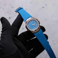 Thumbnail for Patek Philippe Nautilus 32mm 18K White Gold Azure Blue Dial Diamond Bezel Ref 7010G-013 - dial and strap held in hand