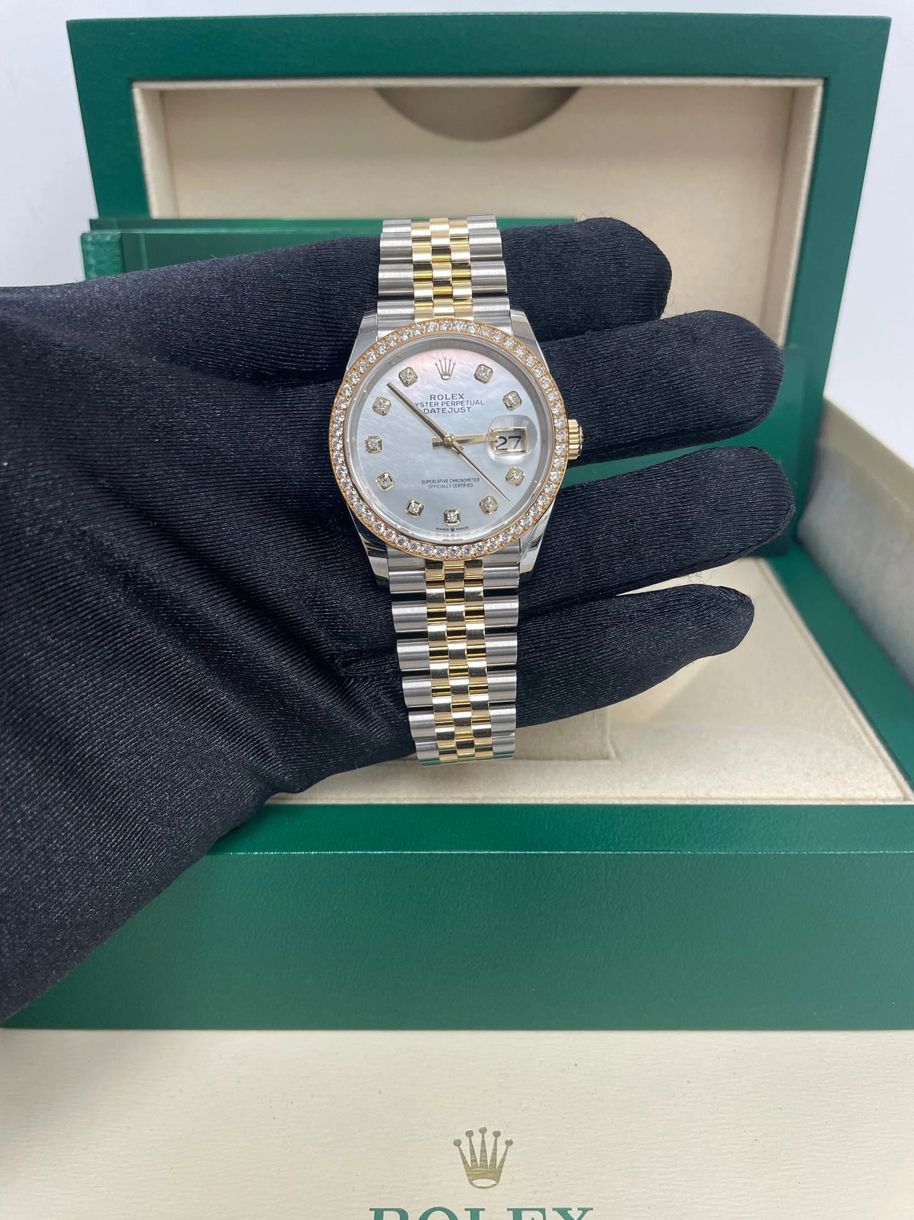Rolex Datejust 36mm Steel and Yellow Gold White Mother of Pearl Diamond Dial Diamond Bezel Jubilee Bracelet Ref 126283RBR-0009 - dial view held in hand