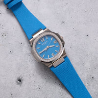 Thumbnail for Patek Philippe Nautilus 32mm 18K White Gold Azure Blue Dial Diamond Bezel Ref 7010G-013 - angled dial view