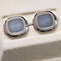 Thumbnail for Patek Philippe Nautilus Cufflinks 18K White Gold Blue Dial - pair close-up from a low angle