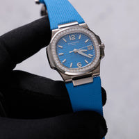 Thumbnail for Patek Philippe Nautilus 32mm 18K White Gold Azure Blue Dial Diamond Bezel Ref 7010G-013 - tilted dial view held in hand