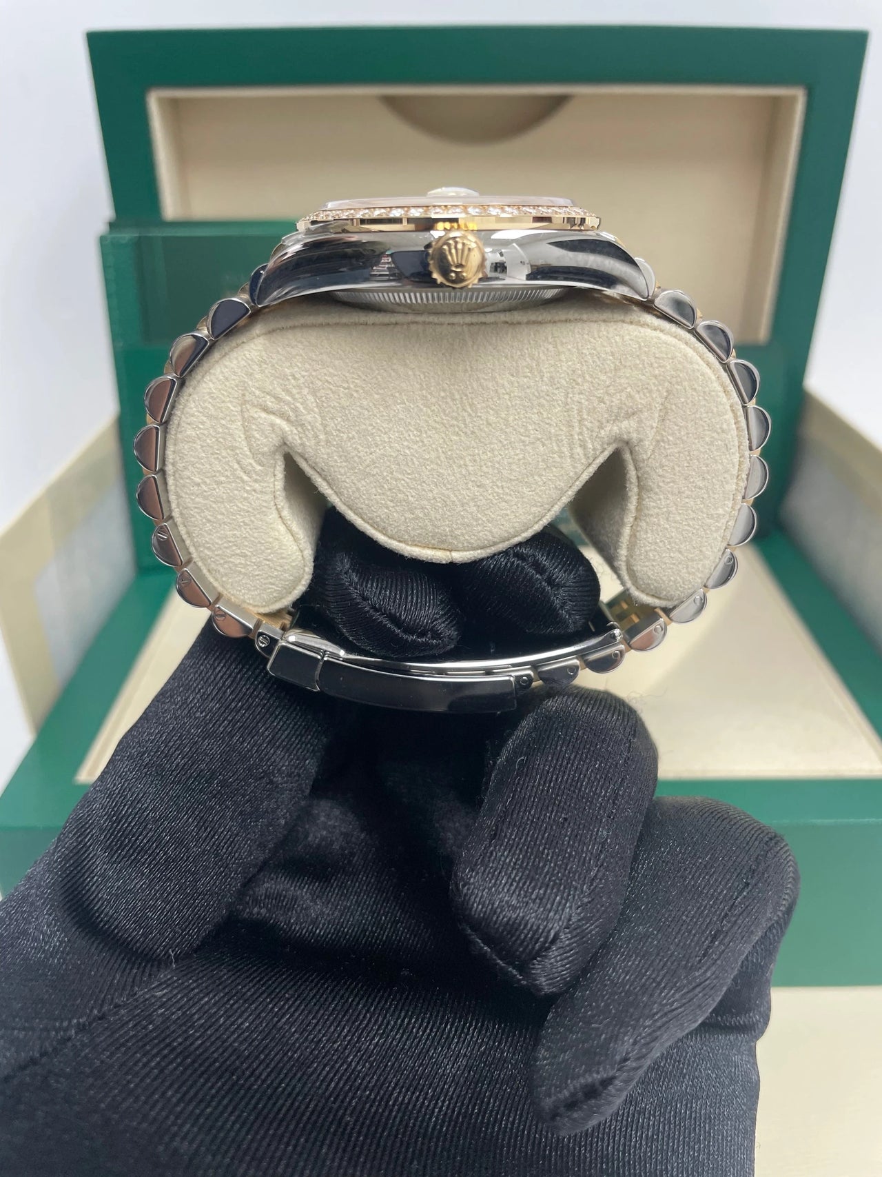 Rolex Datejust 36mm Steel and Yellow Gold White Mother of Pearl Diamond Dial Diamond Bezel Jubilee Bracelet Ref 126283RBR-0009 - clasp and crown-side profile, held in hand