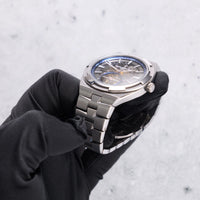 Thumbnail for Vacheron Constantin Overseas Tourbillon Skeleton 42.5mm Titanium Skeleton Dial 6000V/210T-B935 - angled crown-side view, held in hand