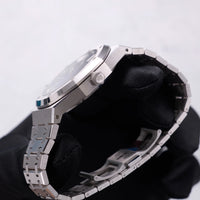 Thumbnail for Audemars Piguet Royal Oak Selfwinding 41mm 18K White Gold Smoked Blue Dial Fixed Bezel Ref 15510BC.OO.1320BC.04 - crown side profile held in hand