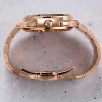 Thumbnail for Patek Philippe Nautilus Travel Time Chronograph 18K Rose Gold Blue Dial Ref 5990/1R-001 - crown side profile with chronograph pushers