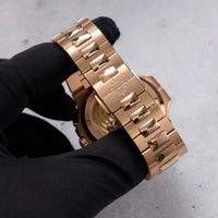 Thumbnail for Patek Philippe Nautilus Travel Time Chronograph 18K Rose Gold Blue Dial Ref 5990/1R-001 - bracelet and clasp detail held in hand