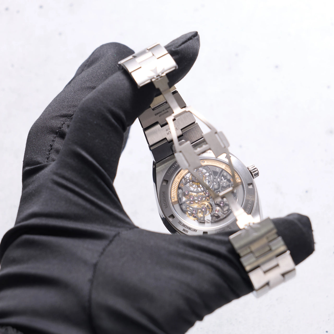Vacheron Constantin Overseas Tourbillon Skeleton 42.5mm Titanium Skeleton Dial 6000V/210T-B935 - sapphire caseback seen through the open folding clasp, held in hand