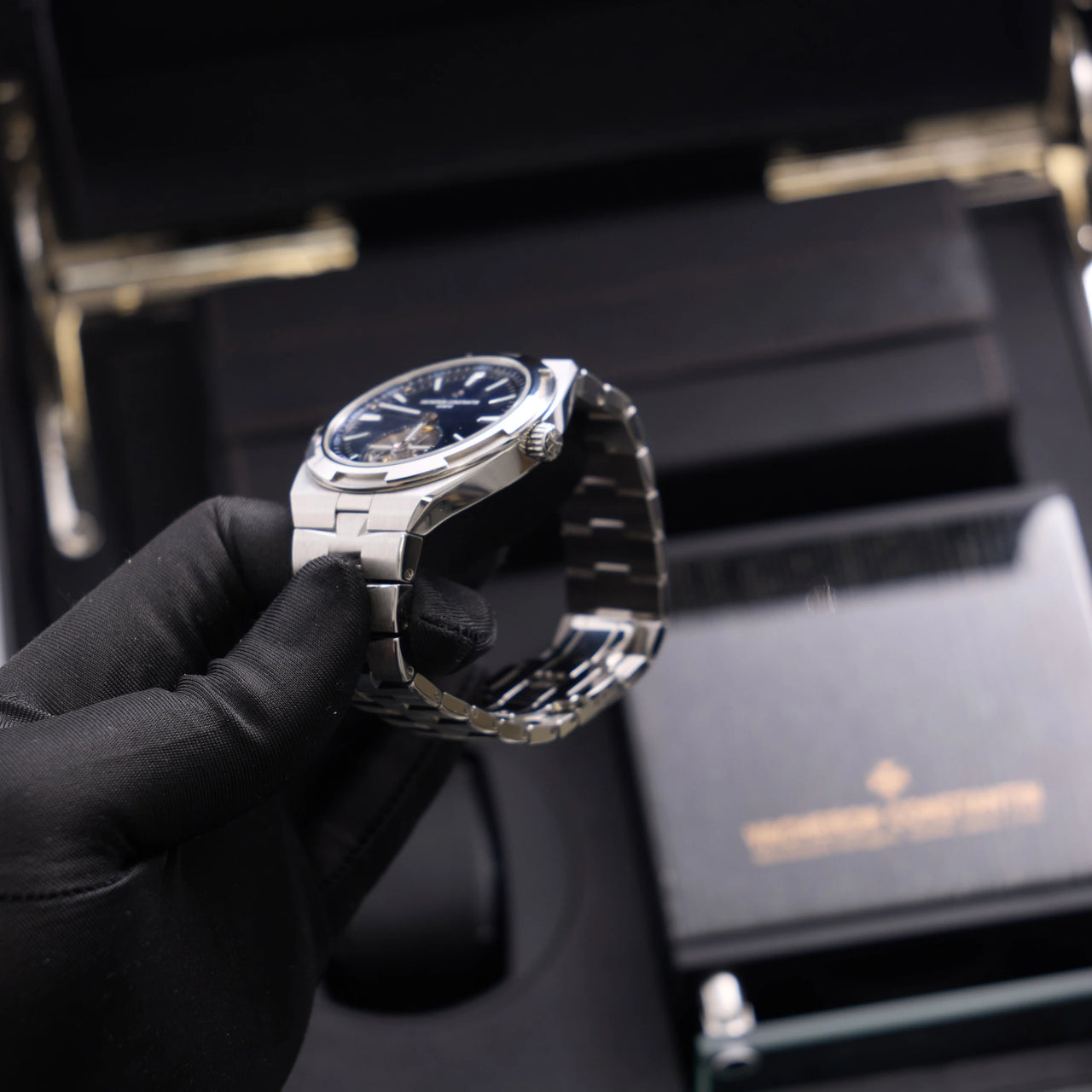 Vacheron Constantin Overseas Tourbillon 42.5mm Stainless Steel Blue Dial (Ref 6000V/110A-B544) - angled view with the crown, held over the box