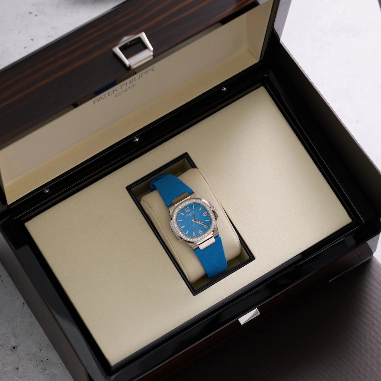 Patek Philippe Nautilus 32mm 18K White Gold Azure Blue Dial Diamond Bezel (Ref 7010G-013) - WatchesOff5thWatch