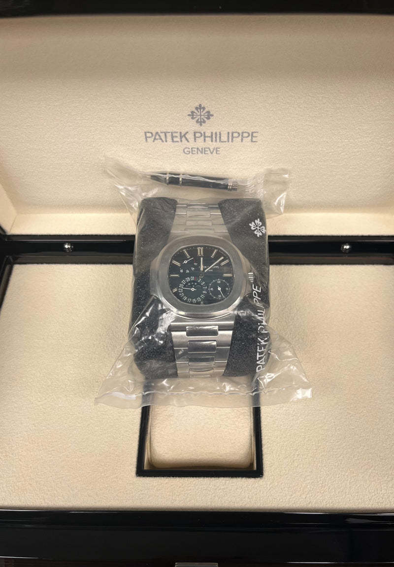 Patek Philippe Nautilus Moon Phase Stainless Steel/ Blue Date Dial (Ref#5712/1A-001) Sealed