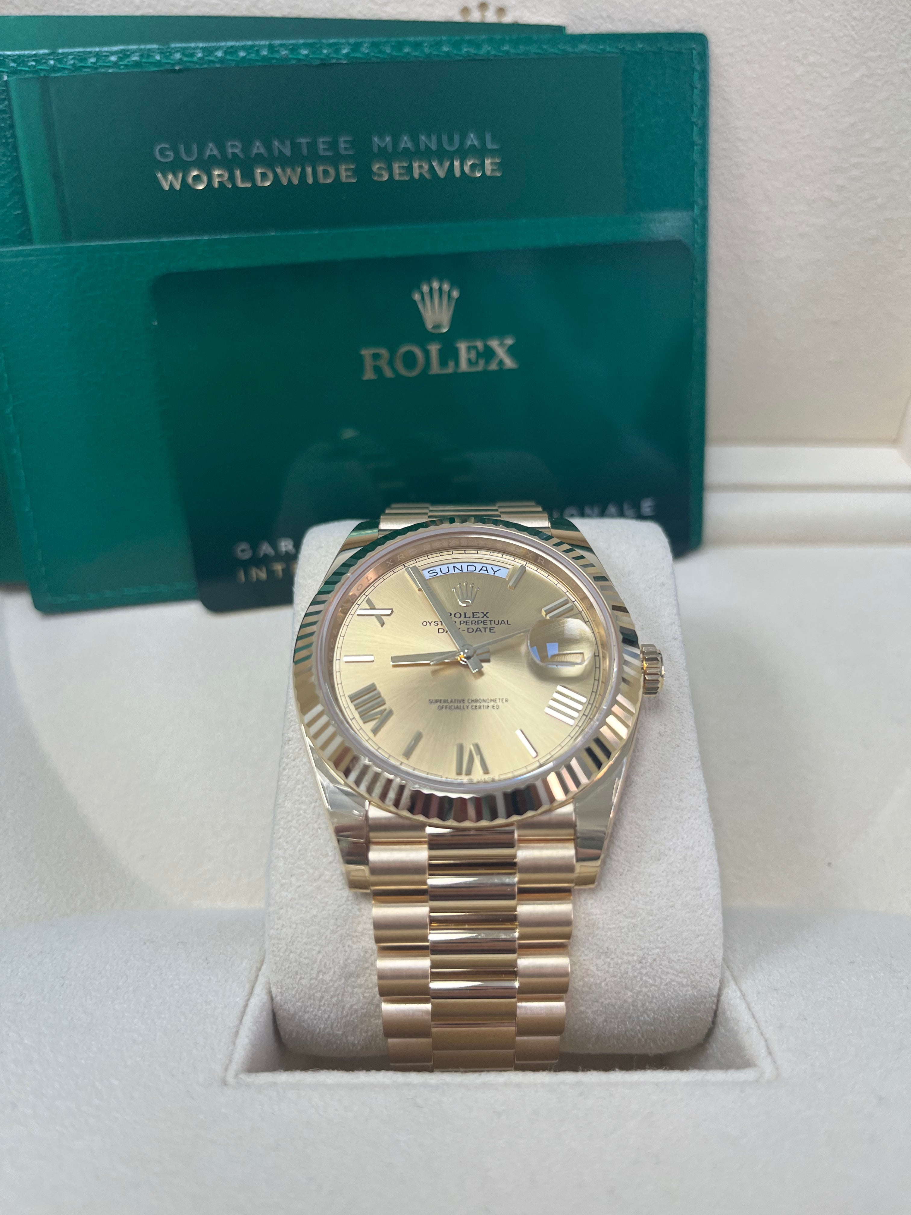 Rolex Day-Date 40 Yellow Gold Champagne Roman Dial Fluted Bezel (Ref # 228238)