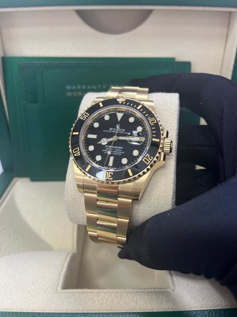 Rolex sub gold black deals