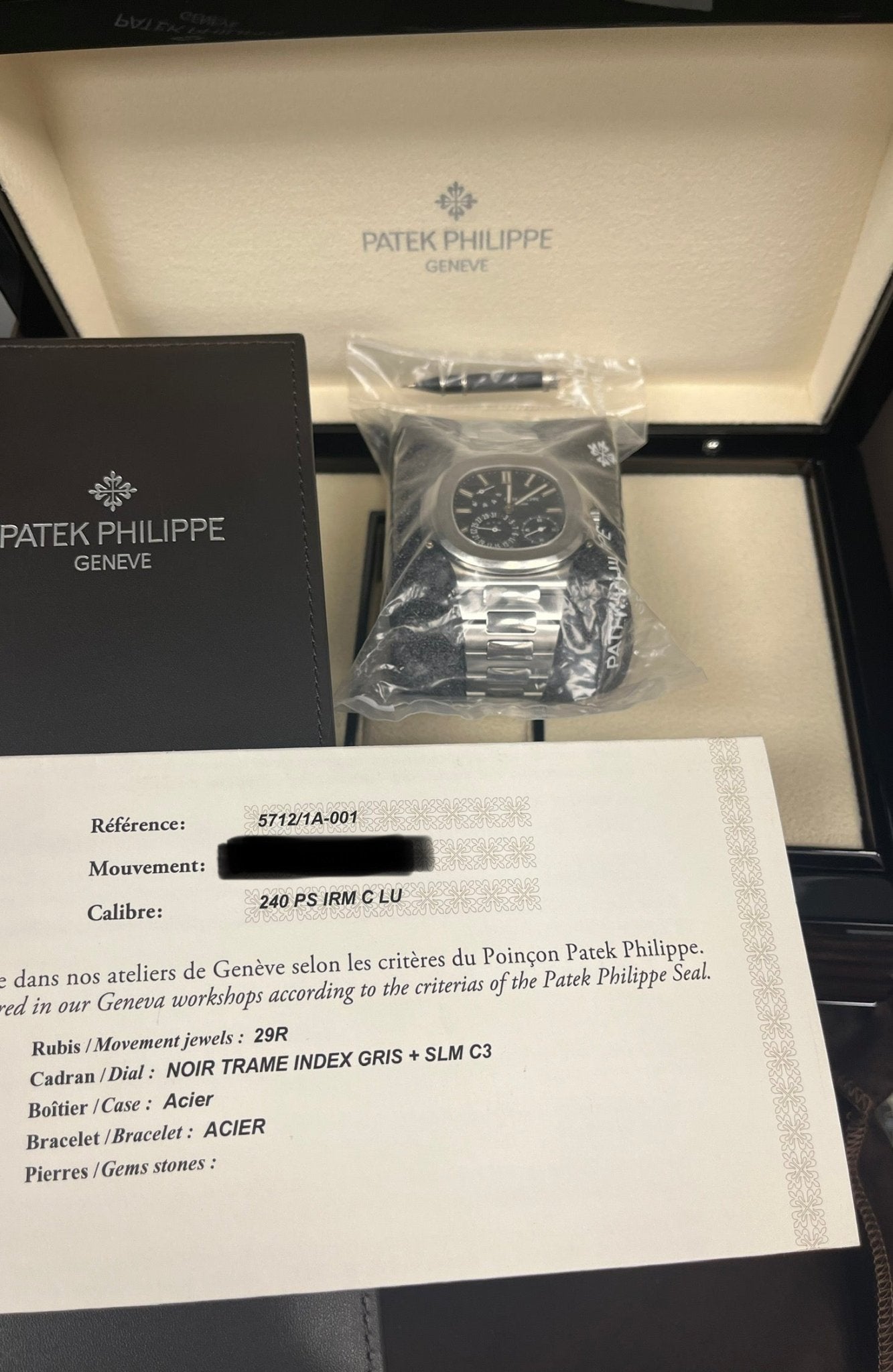 Patek Philippe Nautilus Moon Phase Stainless Steel/ Blue Date Dial (Ref#5712/1A-001) Sealed - WatchesOff5thWatch