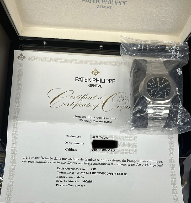Patek Philippe Nautilus Moon Phase Stainless Steel/ Blue Date Dial (Ref#5712/1A-001) Sealed - WatchesOff5thWatch